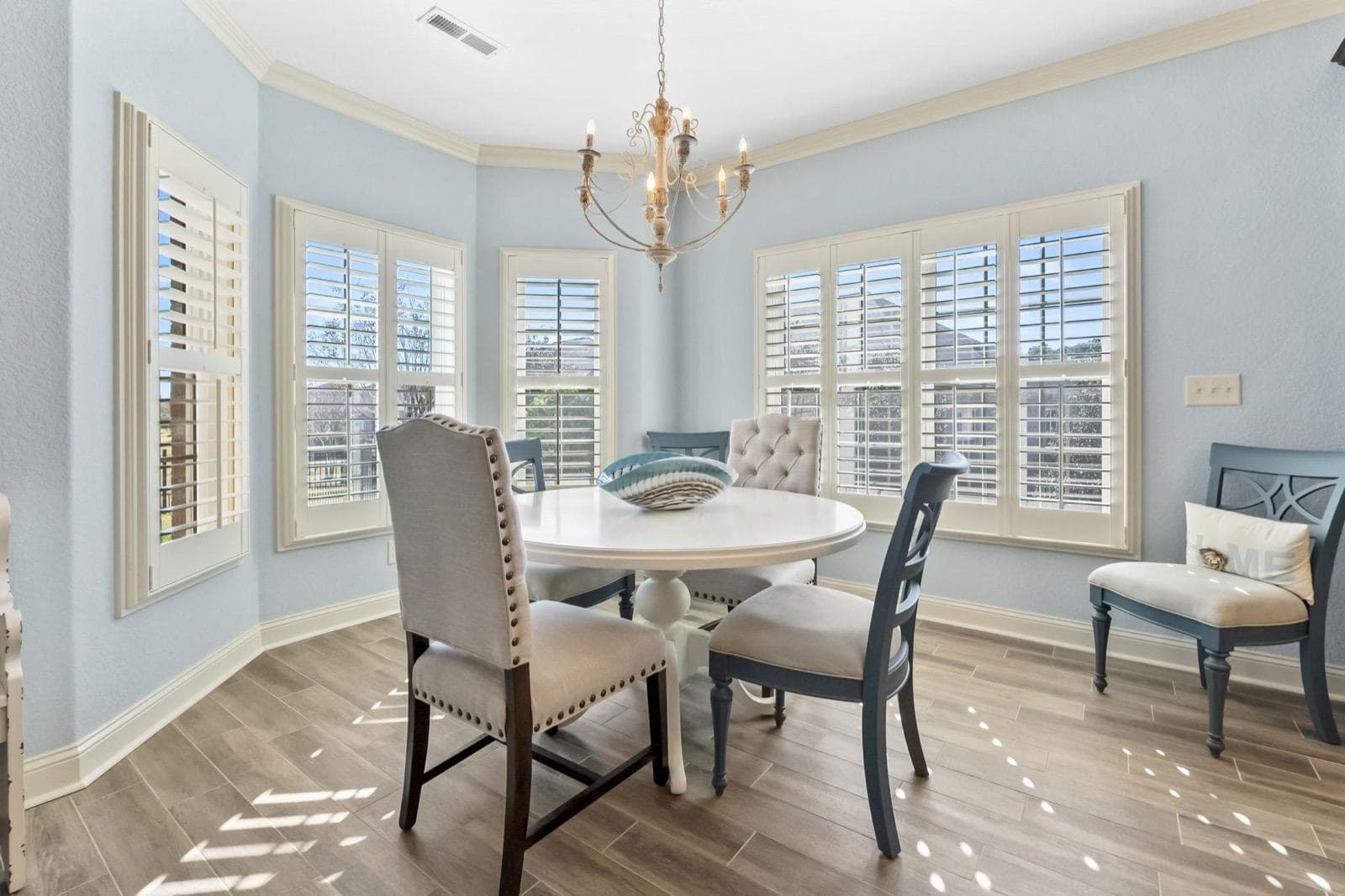 A dining room in a bay window, one of Robin's listings