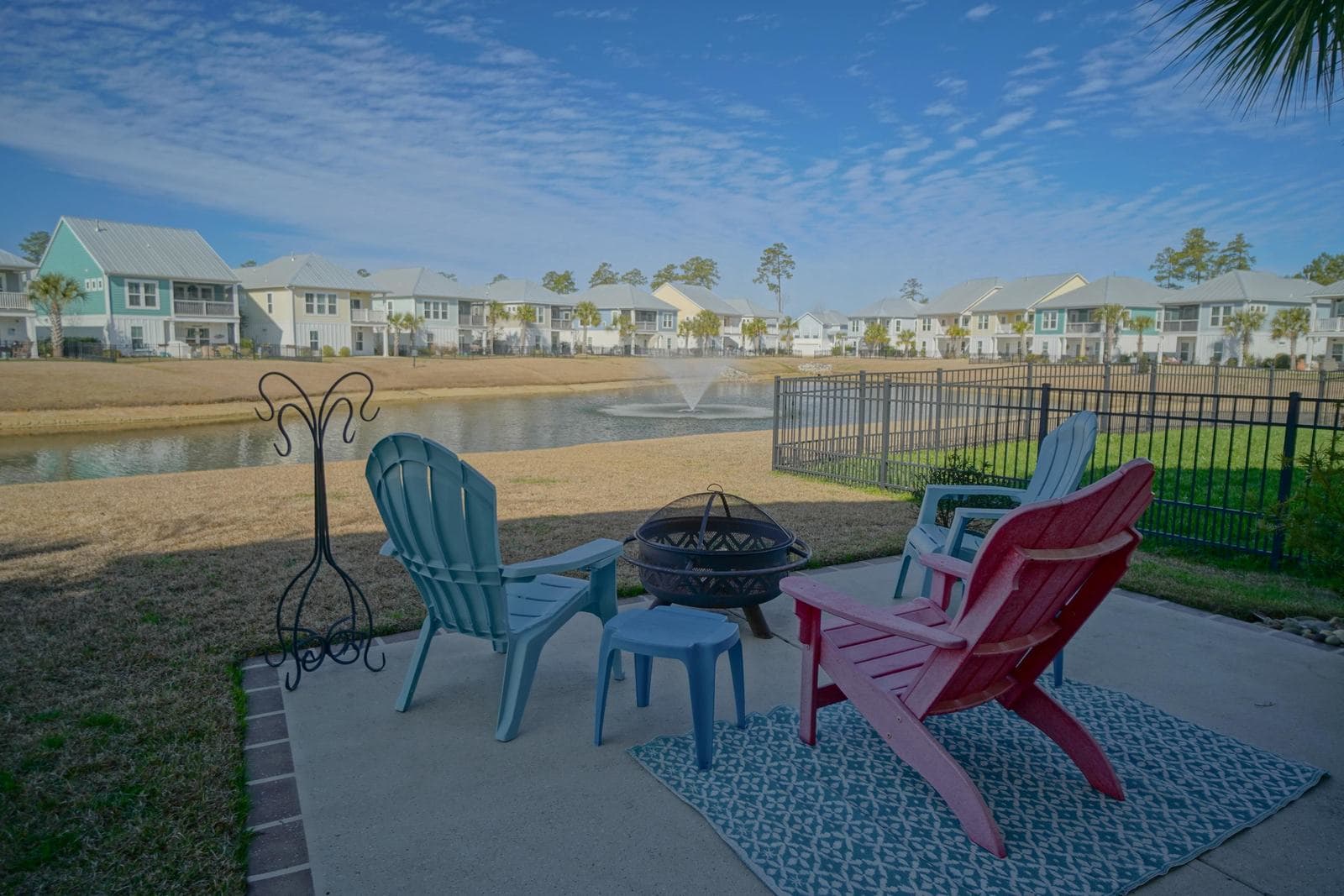 Adirondack chairs on a patio by the pond in Prince Creek, Murrells Inlet